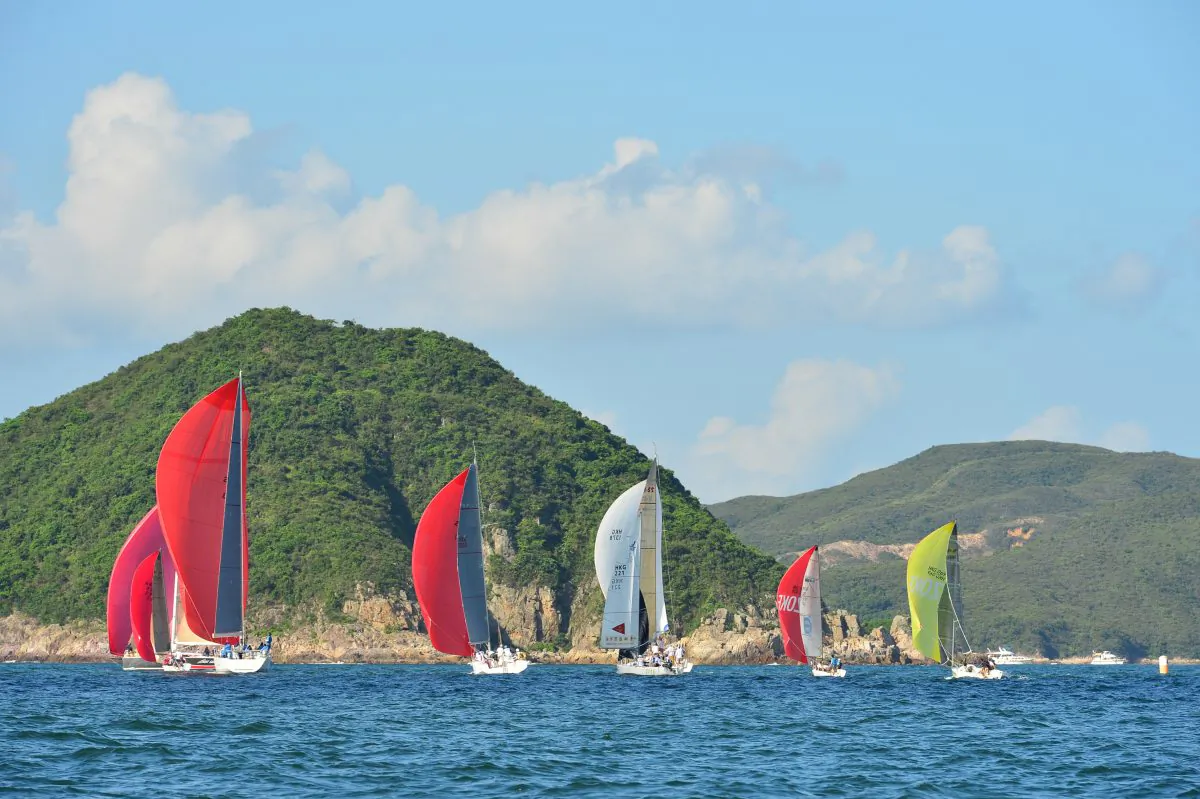 Boats sailing downwind, spinnakers filled, during Race-4 of the UK Sailmakers Summer Saturday Series in Port Shelter on Saturday June 27, 2015. (Bill Cox/Epoch Times)