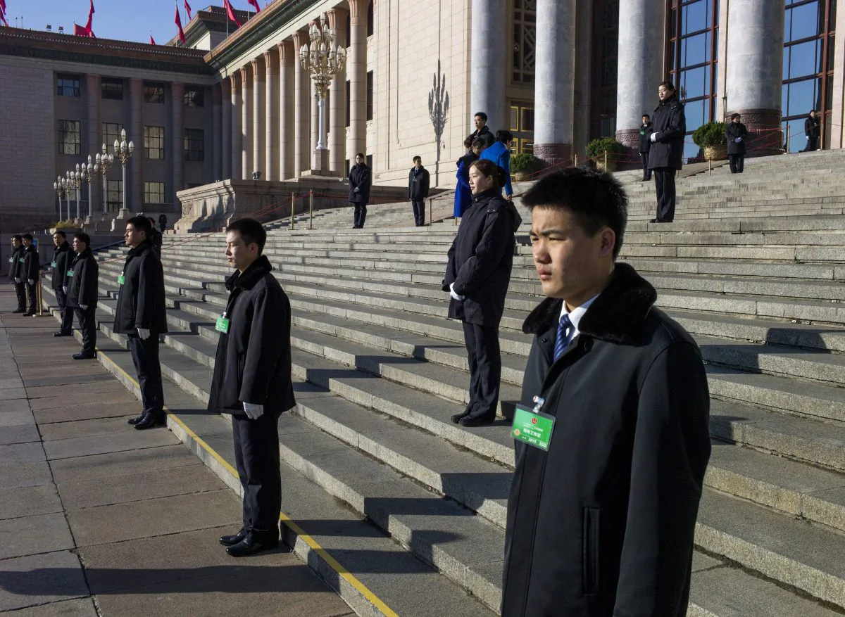 Chinese security guards stand outside a meeting of the National People's Congress in Beijing on March 10. The Chinese regime passed a new national security law that undermines foreign businesses. (Fred Dufour/AFP/Getty Images)