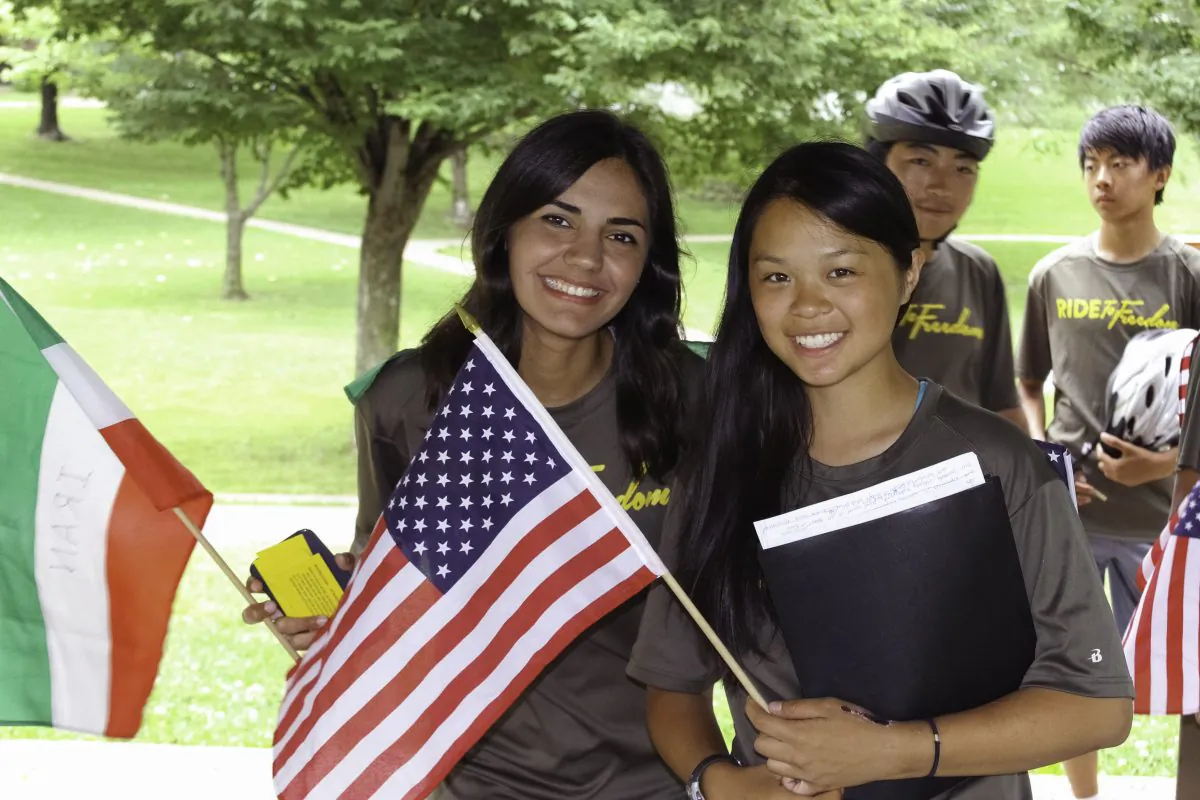 Global Ambassadors, Ghazal Tavanael from Iran and Annie Chen from the USA at a Ride2Freedom rally at Lawrence, Kan., on June 26, 2015. (Chris Jasurek/Epoch Times)