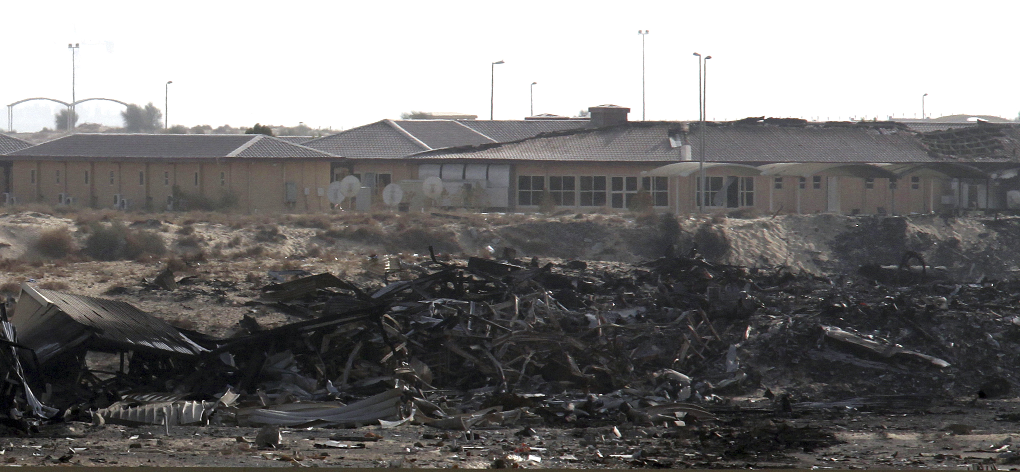 FILE - In this Sept. 5, 2010 file photo, a general view of the military compound where a 747-400 Boeing cargo plane operated by United Parcel Service Inc crashed in Dubai. Lawmakers, responding to pleas from industry and foreign governments, have tentatively agreed to block the Obama administration from requiring lithium batteries be treated as hazardous cargo because of the danger of fires during flight. (AP Photo/File)