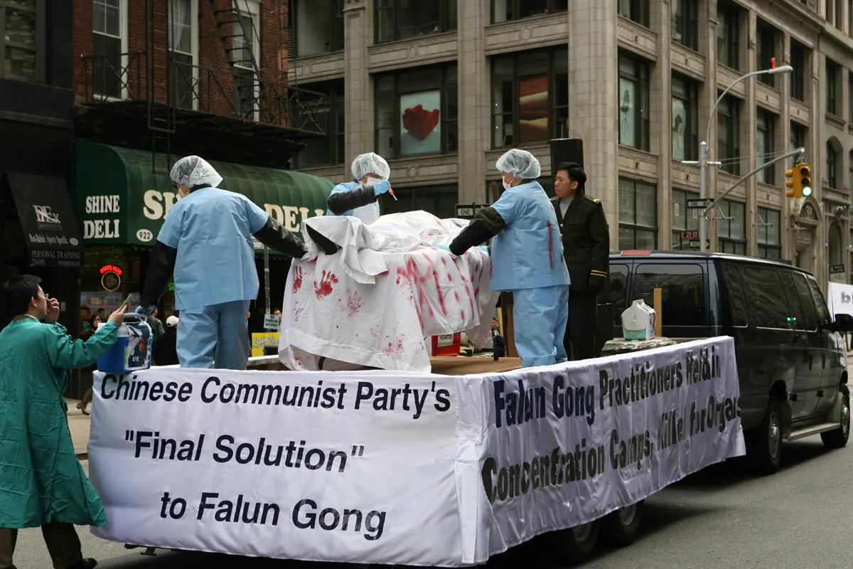 Falun Gong practitioners reenact a scene of organ-harvesting in a parade in New York City (The Epoch Times)