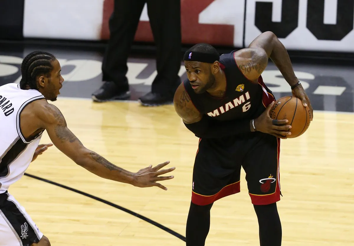 When LeBron James (R) joined the Miami Heat in 2010, they became instant title contenders while his former Cleveland team fell to the bottom of the league. (Chris Covatta/Getty Images) 