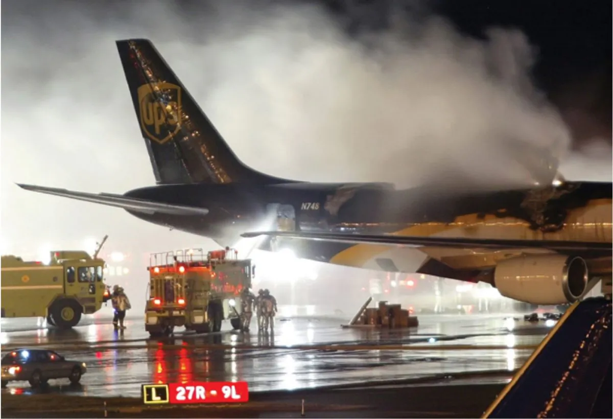 An emergency crew arrives on the scene where a UPS 747-400 Boeing cargo plane caught fire due to lithium ion batteries in Dubai on Sept. 5, 2010. (Courtesy of Federal Aviation Administration)