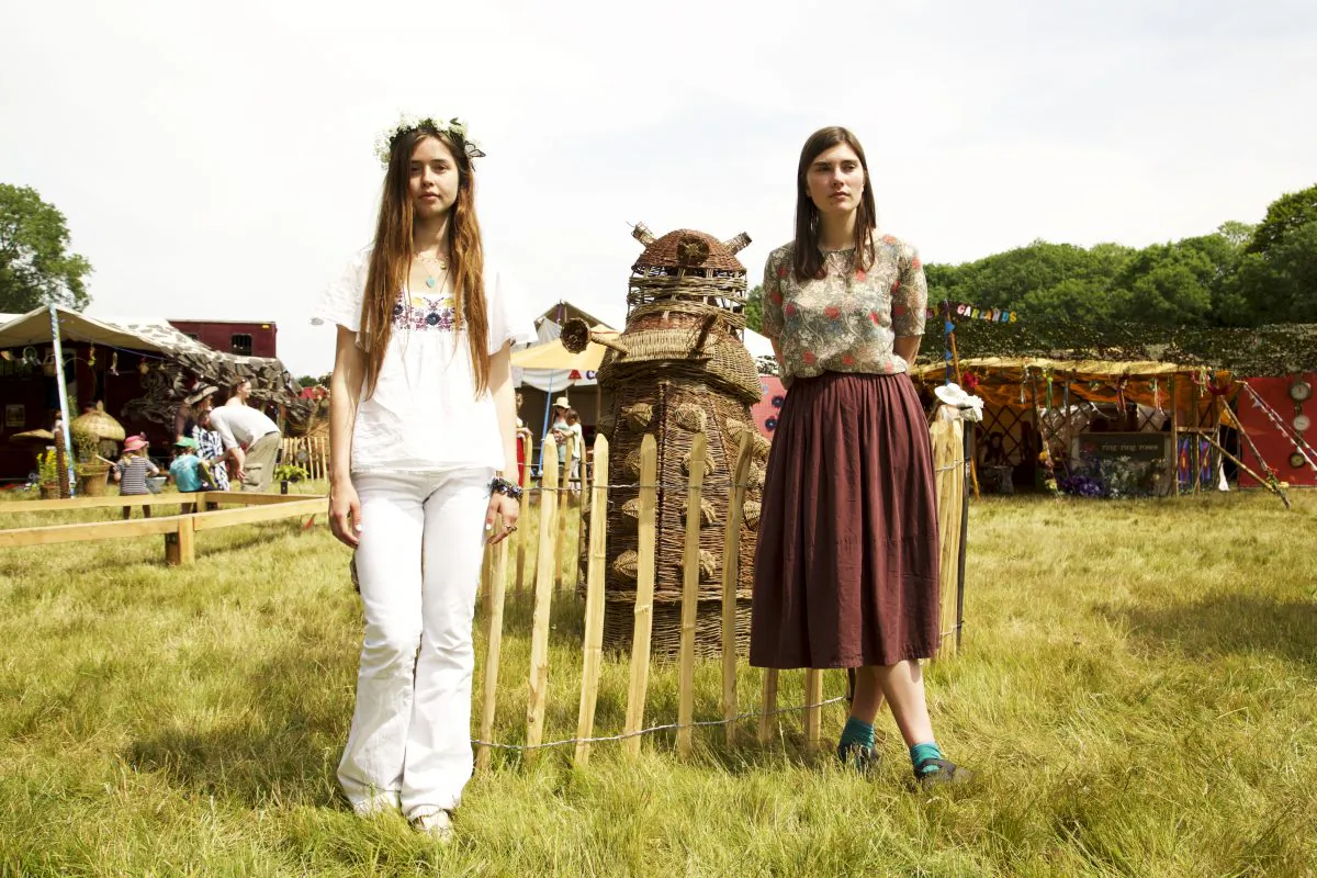 (L-R) Musicians Flo Morrisey and Floella Grace hang out together with a wicker dalek at Blissfields time themed festival
