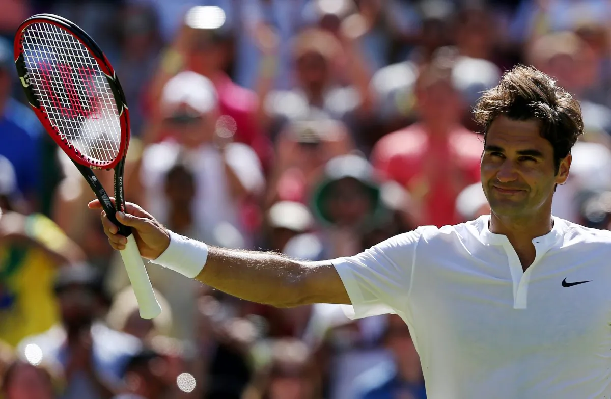 Switzerland's Roger Federer celebrates beating Australia's Samuel Groth during their men's singles third round match on day six of the 2015 Wimbledon Championships at The All England Tennis Club in Wimbledon, southwest London, on July 4, 2015. Federer won 6-4, 6-4, 6-7, 6-2. (Justin Tallis/AFP/Getty Images)