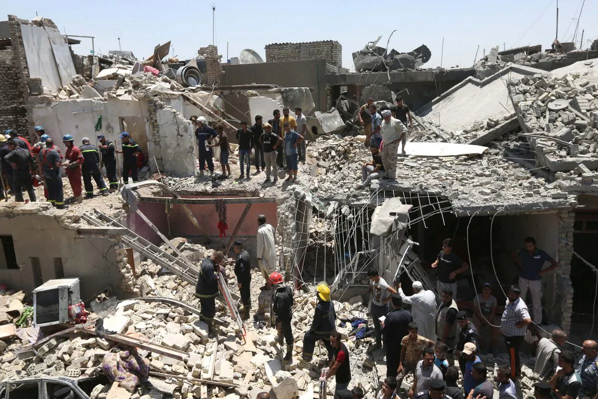 Iraqi security forces search for survivors after a bombing attack in the eastern neighborhood of New Baghdad. Iraq, Monday, July 6, 2015. (AP Photo/ Hadi Mizban)