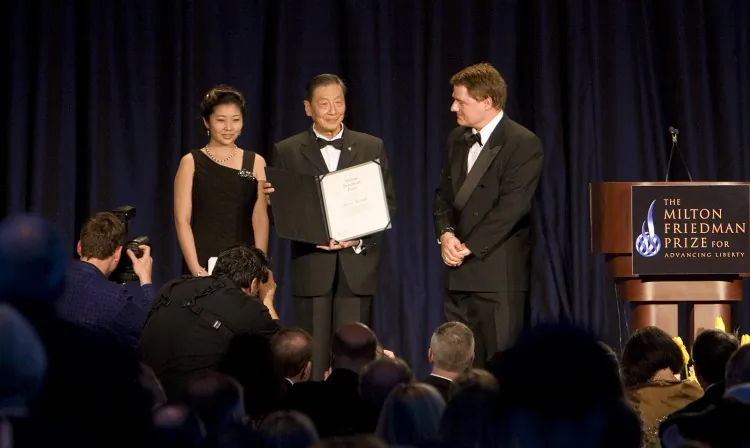 Mao Yushi with his granddaughter (L), and Cato's Tom Palmer (R), after receiving the Milton Friedman Prize for Advancing Liberty on May 4. (Lisa Fan/The Epoch Times)