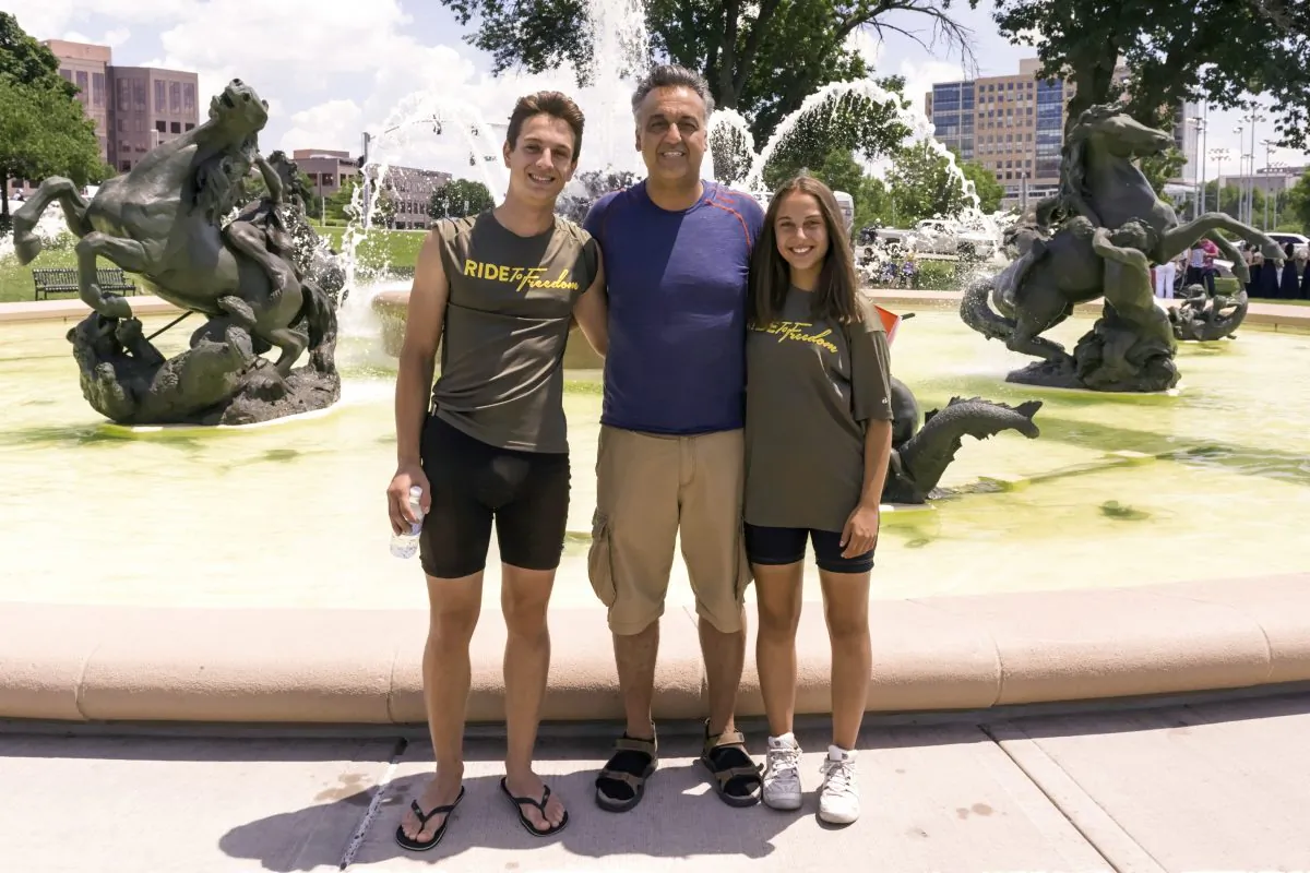 Pasdar family at the Country Club Plaza, KCMO on June 27, 2015. Arian (left), Reza and Anahita Pasdar from Austria on Day 27.  (Cat Rooney/Epoch Times)
