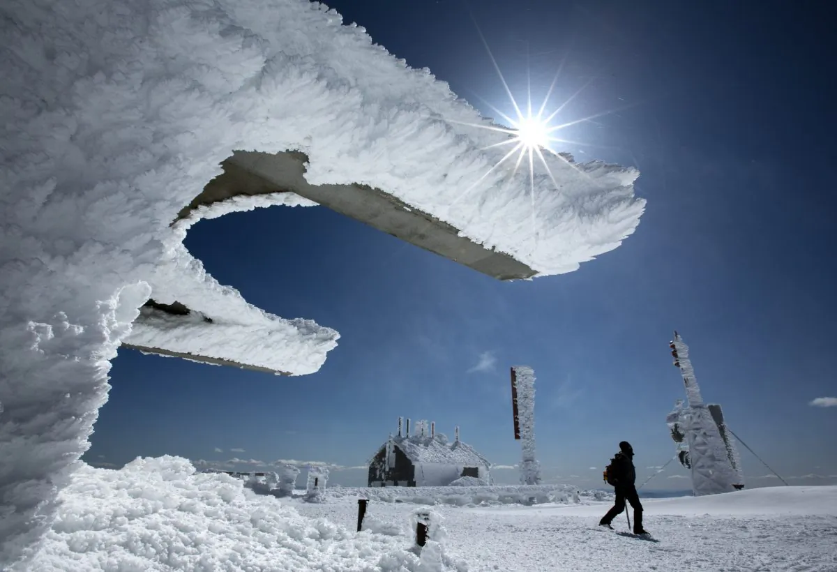 Rime ice coats the buildings and antennas on top of Mt. Washington, Saturday, March 30, 2013, in New Hampshire. (AP Photo/Robert F. Bukaty)