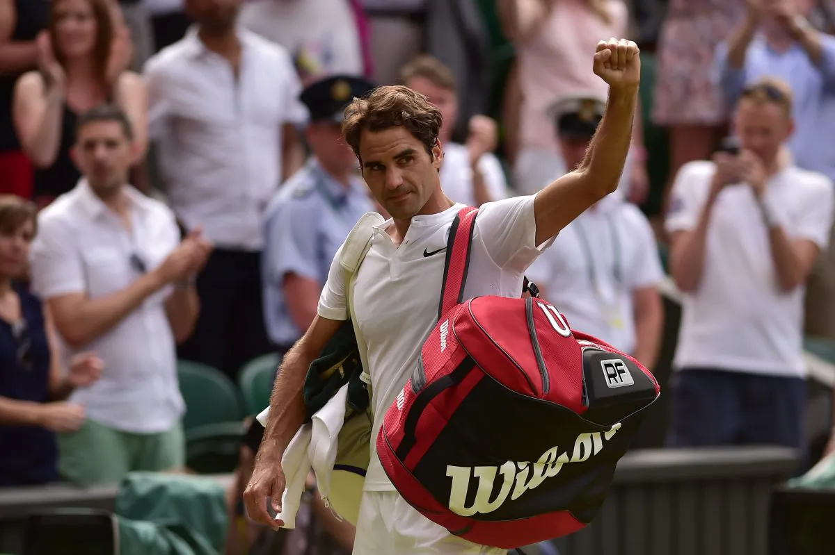 Switzerland's Roger Federer waves to the crowd as he leaves the court after beating Britain's Andy Murray during their men's semi-final match on day eleven of the 2015 Wimbledon Championships at The All England Tennis Club in Wimbledon, southwest London, on July 10, 2015. Federer won the match 7-5, 7-5, 6-4. (Leon Neal/AFP/Getty Images)