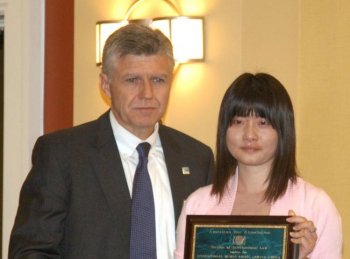 Gao Zhisheng's 17-year-old daughter Grace accepted the International Human Rights Lawyer Award on his behalf at an event held in San Francisco on Friday, Aug. 6. (Huang Yiyan/The Epoch Times)