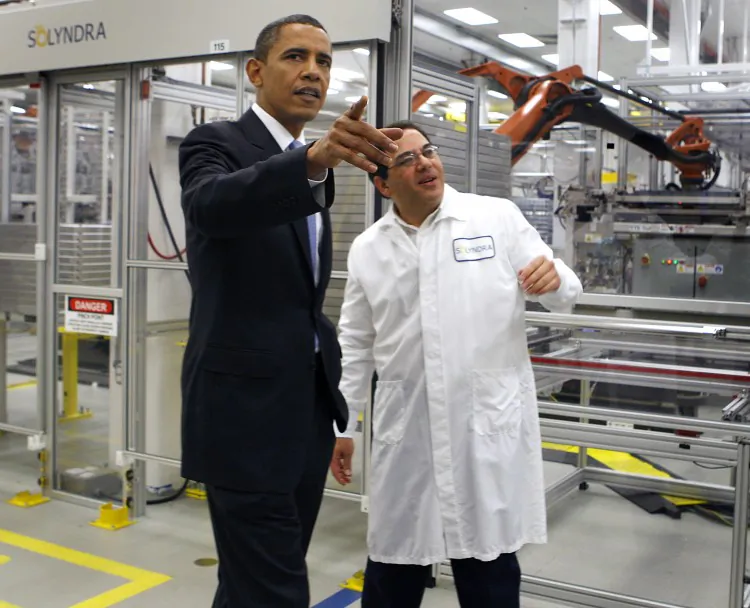 President Barack Obama (L) tours the Solyndra solar panel company with Executive VP of Engineering Ben Bierman, in Fremont, Calif., on May 26, 2010. In September 2011, Solyndra filed for Chapter 11 of the U.S. Bankruptcy Code after shutting down operations and laying off 1,100 of its workers. (Paul Chinn/Pool/Getty Images)