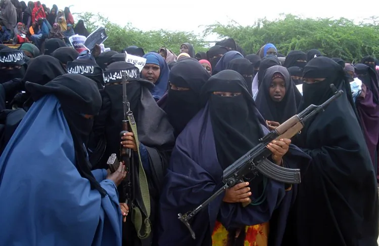 Somali women carry weapons during a demonstration organized by the Islamist Al-Shabaab group in 2010. (Abdurashi Abikar/AFP/Getty Images)