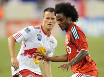 Julian de Guzman (R) of Toronto FC and Seth Stammler (L) of the New York Red Bulls battle at Red Bull Arena in Harrison, New Jersey. (Stan Honda/AFP/Getty Images)