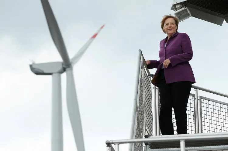 German Chancellor Angela Merkel pauses on a wind turbine platform while visiting a windpark on Aug. 18, 2010 in Krempin, Germany. Following Germany's decision to cut off its reliance on nuclear power, Munich is looking to make wind power one of its main electricity sources. (Sean Gallup/Getty Images)