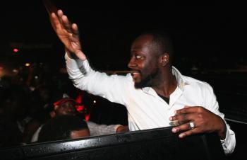 Wyclef Jean waves to supporters as he leaves a hotel while waiting to hear if he will be considered eligible to run for the Nov. 28 presidential election on August 20, 2010 in Port-au-Prince, Haiti.  (Joe Raedle/Getty Images)