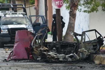 A burned car pictured in front of Televisa's local office in Ciudad Victoria after a car bomb exploded early Friday. (Ronaldo Schemidt/AFP/Getty Images)