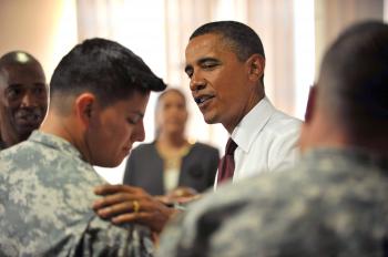 President Barack Obama shakes hands with Iraq war veterans on Aug. 31, at Fort Bliss Army Base in Texas. (Tim Sloan/AFP/Getty Images)
