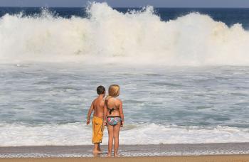 Eight-year-olds Morgan Langley (R) and Stephen Lee (L) watch the high surf caused by Hurricane Earl on Sept.1 in Kitty Hawk, North Carolina. (Mark Wilson/Getty Images)