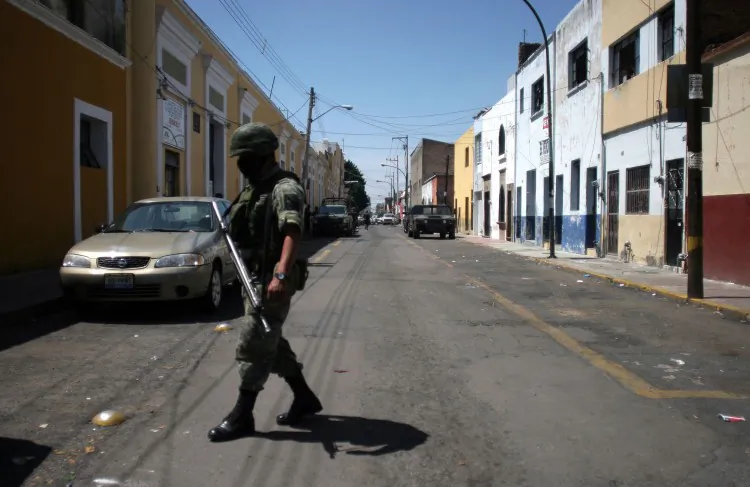A Mexican soldier stands guard in front of the Forensic Institute in Guadalajara, Mexico. (Hector Guerrero/AFP/Getty Images)