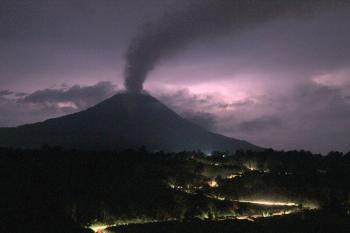 A time exposure on September 6, 2010 shows a plume of volcanic ash rising from the crater of Mount Sinabung as seen from Tanah Karo district in North Sumatra province, some two hours before its eruption.