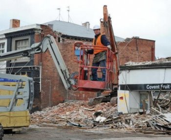 A worker works near buildings being demolished following earthquake damage in Christchurch on September 7. Residents of Christchurch New Zealand's second largest city, spent another night enduring aftershocks following the powerful 7.0 earthquake that rocked the area on September 4.(Greg Wood/Getty Images) A worker works near buildings being demolished following earthquake damage in Christchurch on September 7. Residents of Christchurch New Zealand's second largest city, spent another night enduring aftershocks following the powerful 7.0 earthquake that rocked the area on September 4.(Greg Wood/Getty Images)