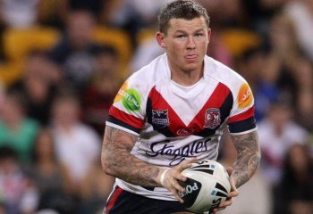 Todd Carney of the Roosters runs with the ball during the First NRL Preliminary Final match between the Gold Coast Titans and the Sydney Roosters at Suncorp Stadium on Sept. 24 in Brisbane. (Bradley Kanaris/Getty Images)