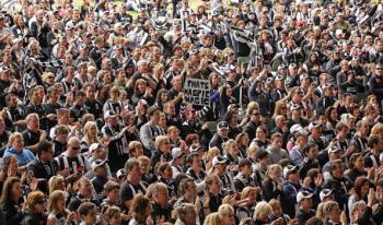 Collingwood fans watch the AFL Grand Final match between the Collingwood Magpies and the St Kilda Saints on a large television screen at the Collingwood Football Clubs Live Site at the Sidney Myer Music Bowl on Sept. 25. ( Scott Barbour/Getty Images)