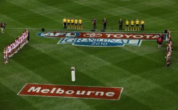 Cam and son Taylor sing the national anthem, before the AFL Grand Final match between the Collingwood Magpies and the St Kilda Saints, at Melbourne Cricket Ground on Sept. 25. (Quinn Rooney/Getty Images) Cam and son Taylor sing the national anthem, before the AFL Grand Final match between the Collingwood Magpies and the St Kilda Saints, at Melbourne Cricket Ground on Sept. 25. (Quinn Rooney/Getty Images)