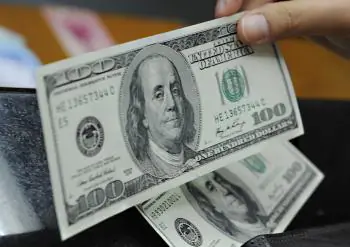 Bernanke Defends Fed Stimulus Actions