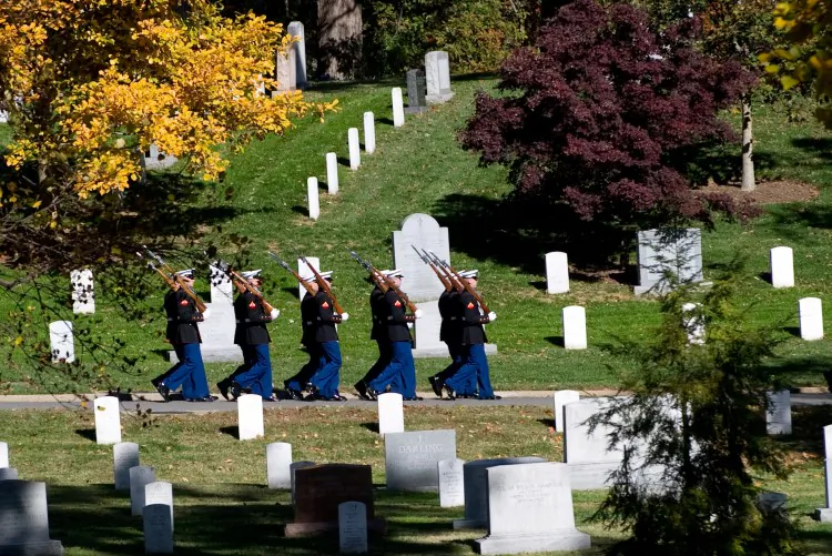 Members of the US Marine Corps Honor Guard march through Arlington National Cemetery in Arlington, Virginia, after participating in ceremonies marking Veteran's Day. (SAUL LOEB/AFP/Getty Images)