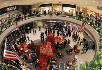 'Midnight Madness' at the Tyson's Corner Center mall. Dec. 24 is traditionally the busiest shopping day of the year and kicks off the holiday shopping season for retailers. (Karen Bleier/AFP/Getty Images) 'Midnight Madness' at the Tyson's Corner Center mall. Dec. 24 is traditionally the busiest shopping day of the year and kicks off the holiday shopping season for retailers. (Karen Bleier/AFP/Getty Images)