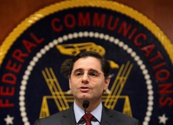 U.S. Federal Communications Commission Chairman Julius Genachowski speaks to the media on December 1, at the headquarters of the FCC in Washington, DC. (Alex Wong/Getty Images)