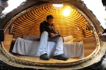 Dai Haifei, 24, from China's Hunan province, rests in his egg-shaped mobile house. (Getty Images) Dai Haifei, 24, from China's Hunan province, rests in his egg-shaped mobile house. (Getty Images)