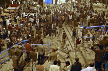 Security officials and onlookers gather at the site of a blast at a 'ghat' (bathing point) in Varanasi on Dec. 7, 2010. (STRDEL/AFP/Getty Images)
