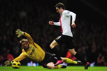 Man City's Adam Johnson rounds West Ham keeper Robert Green to score Citys third goal during the Barclays Premier League match on Dec. 11 in London. (Shaun Botterill/Getty Images) Man City's Adam Johnson rounds West Ham keeper Robert Green to score Citys third goal during the Barclays Premier League match on Dec. 11 in London. (Shaun Botterill/Getty Images)