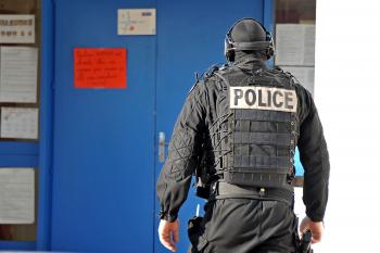A member of French National Police Intervention Group forces (GIPN) walks in the nursery school, where a sword-wielding teenager was holding five children and a teacher on Dec. 13 in Besancon, France. (Harold Cunningham/Getty Images)