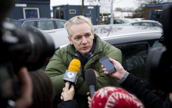WikiLeaks founder Julian Assange speaks to journalists outside Diss train station in Norfolk on Dec. 18, 2010. (Carl Court/AFP/Getty Images)