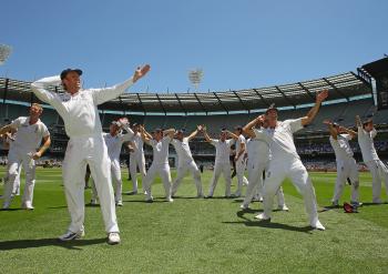 The English cricket team perform 'The Sprinkler' dance after winning the Fourth Test on Day 4 at the MCG Dec. 29. The victory means that England has retained the Ashes on Australian soil. (Quinn Rooney/Getty Images) The English cricket team perform 'The Sprinkler' dance after winning the Fourth Test on Day 4 at the MCG Dec. 29. The victory means that England has retained the Ashes on Australian soil. (Quinn Rooney/Getty Images)