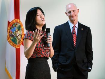 Michelle Rhee, who was named as the Informal Education Advisor to the Governor, speaks as Florida Gov. Rick Scott (R) listens during a visit to the Florida International Academy on Jan. 6 in Opa Locka, Florida.  (Joe Raedle/Getty Images)