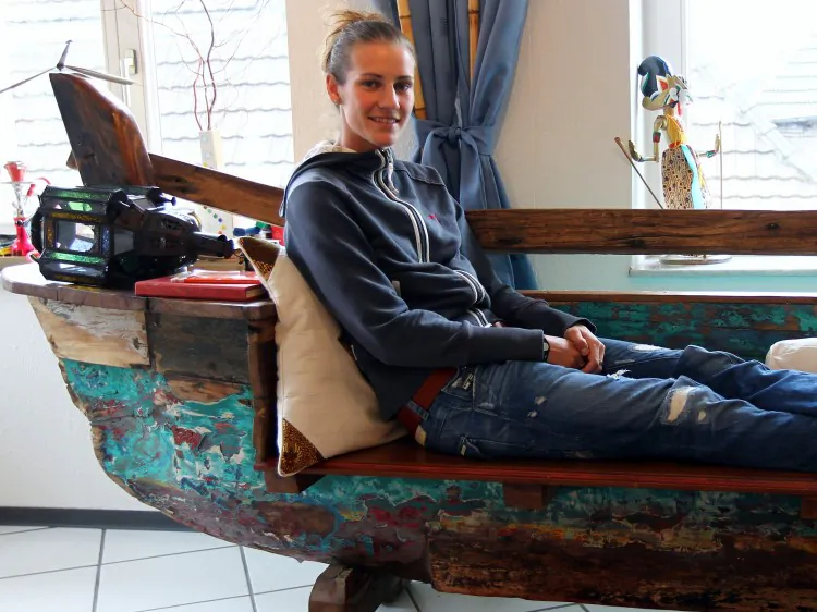 Simone Laudehr sits on an old bench in her living room during a photocall on October 6, 2010 in Straelen, Germany. (Lars Baron/Bongarts/Getty Images)
