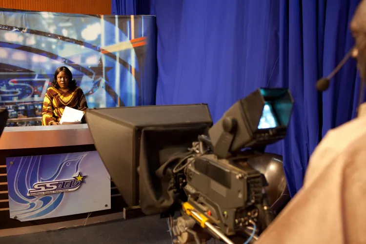 Southern Sudanese Mayo James Amajok presents the news at the television studio of the Southern Sudan TV station in Juba on Jan. 13, 2011. (Yasuyoshi Chiba/AFP/Getty Images)
