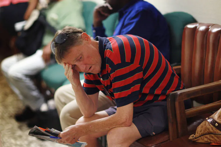 Stewart Kern waits to apply for food stamps at the Cooperative Feeding Program on Feb. 10, 2011, in Fort Lauderdale, Fla. The food stamp program was used by 43.6 million people in November 2010. Before the 2008 recession, the program was serving 26 million. (Joe Raedle/Getty Images)