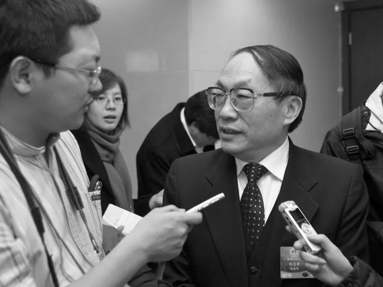 Photo taken on March 5, 2009 shows China's former railway minister Liu Zhijun (R) being interviewed in Beijing. (STR/AFP/Getty Images)