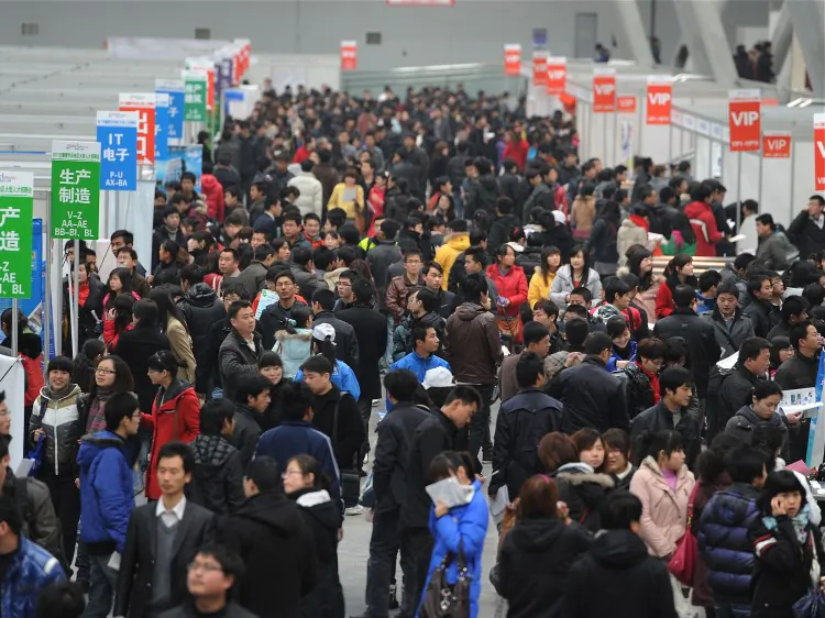 Job seekers check out the various vacancies offered at a job fair in Hefei, east China's Anhui Province, on Feb. 26, 2011. Jobs at state-run companies and government jobs are in high demand. (AFP/AFP/Getty Images)