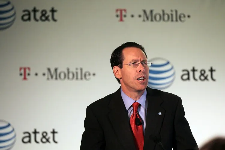 Randall Stephenson, CEO of AT&T, is seen speaking at the news conference announcing the proposed merger of AT&T and T-Mobile USA on March 21 in New York City. The deal has been opposed by the Department of Justice and rival Sprint Corp. (Spencer Platt/Getty Images)