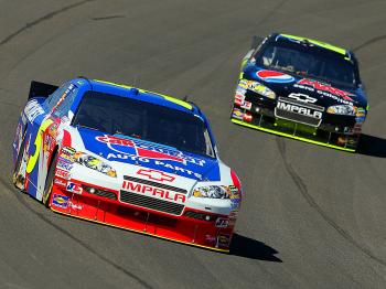 Hendrick's drivers Mark Martin, in the #5 CARQUEST Auto Parts/GoDaddy.com Chevrolet, and Jeff Gordon, in the #24 DuPont Chevrolet, took their turns at the front during the during the NASCAR Sprint Cup Pepsi Max 400. (Jeff Gross/Getty Images) Hendrick's drivers Mark Martin, in the #5 CARQUEST Auto Parts/GoDaddy.com Chevrolet, and Jeff Gordon, in the #24 DuPont Chevrolet, took their turns at the front during the during the NASCAR Sprint Cup Pepsi Max 400. (Jeff Gross/Getty Images)