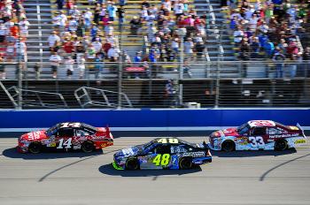 Tony Stewart leads Jimmie Johnson and Clint Bowyer near the end of the Pepsi Max. Bowyer got by Johnson, but couldn't catch Stewart. (Harry How/Getty Images) Tony Stewart leads Jimmie Johnson and Clint Bowyer near the end of the Pepsi Max. Bowyer got by Johnson, but couldn't catch Stewart. (Harry How/Getty Images)