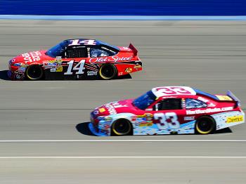 Tony Stewart in the #14 Office Depot Chevrolet beat Clint Bowyer in the #33 The Hartford Chevrolet across the finish line by less than half a second at the NASCAR Sprint Cup Series Pepsi Max 400. (Harry How/Getty Images) Tony Stewart in the #14 Office Depot Chevrolet beat Clint Bowyer in the #33 The Hartford Chevrolet across the finish line by less than half a second at the NASCAR Sprint Cup Series Pepsi Max 400. (Harry How/Getty Images)
