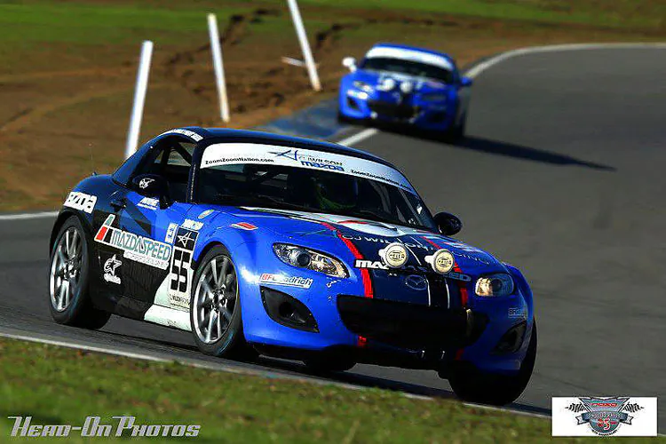MLB pitcher and part-time racer CJ Wilson (L) stops for a quick picture with his friend and driver Tristan Nunez before the 2012 25 Hours of Thunderhill. (Tristannunez.com)
